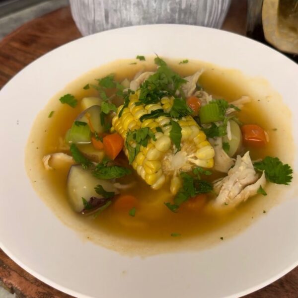 Caldo de Pollo Mexican chicken soup with vegetables in a clear broth