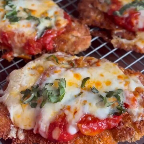 Classic crispy chicken parmesan with melted cheese and marinara