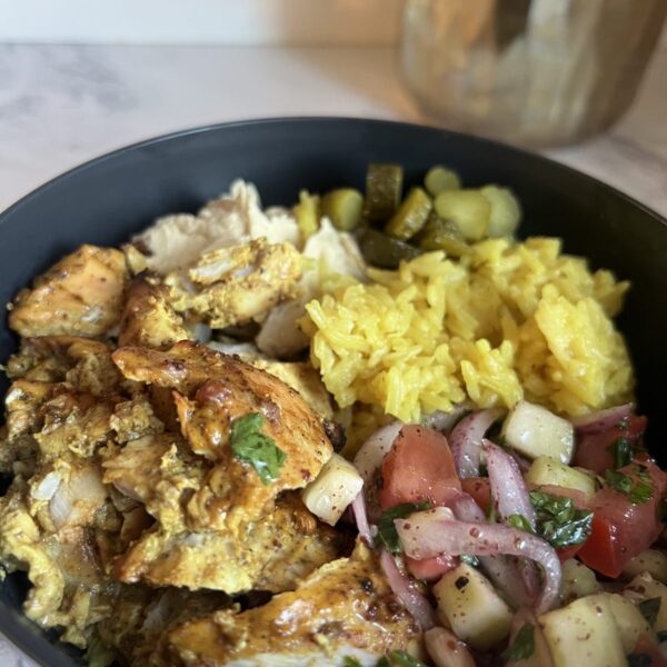 Chicken shawarma bowls with turmeric rice and fresh vegetables
