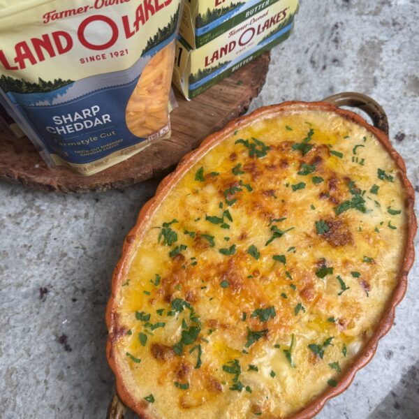 Creamy cheesy scalloped potatoes layered in a baking dish