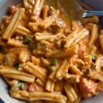 Casarecce pasta in creamy tomato sauce with Italian sausage and fresh parsley