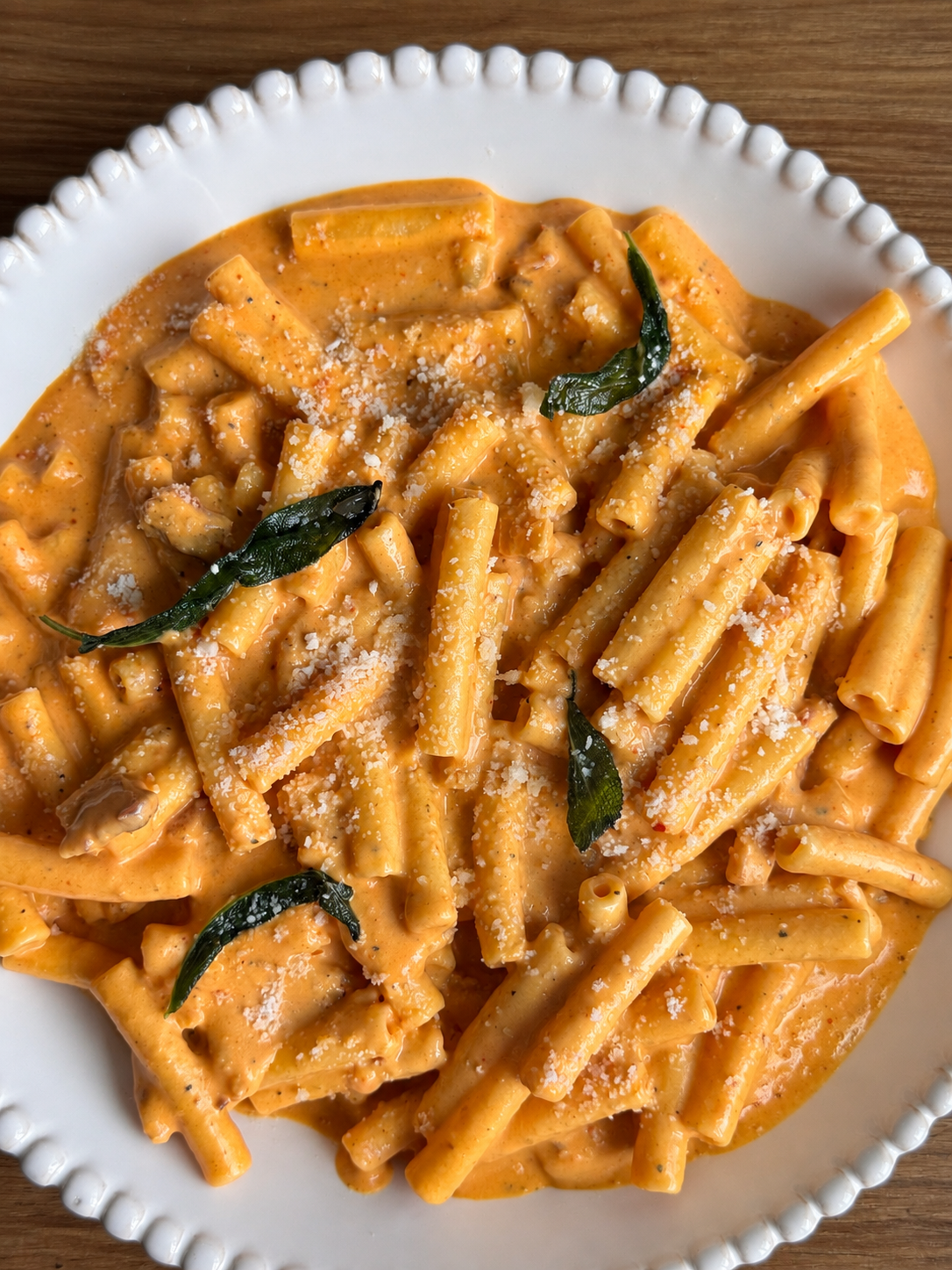 Ziti in creamy pumpkin vodka sauce with crispy sage and grated parmesan