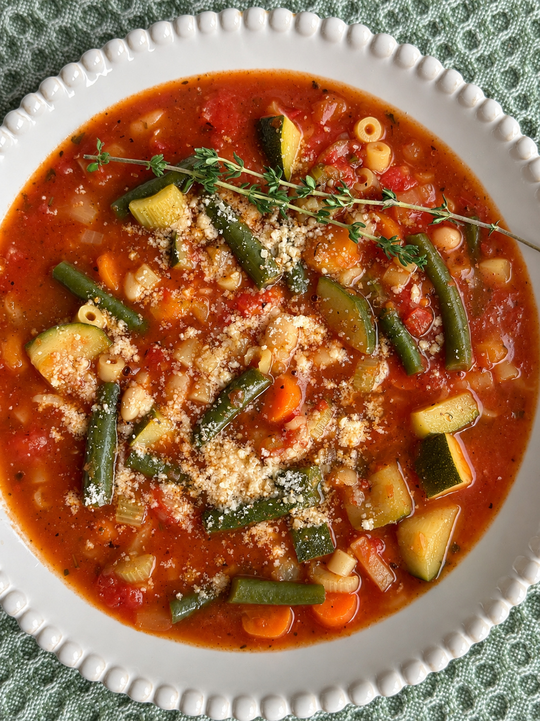 Minestrone with ditalini, green beans and zucchini under a dusting of parmesan